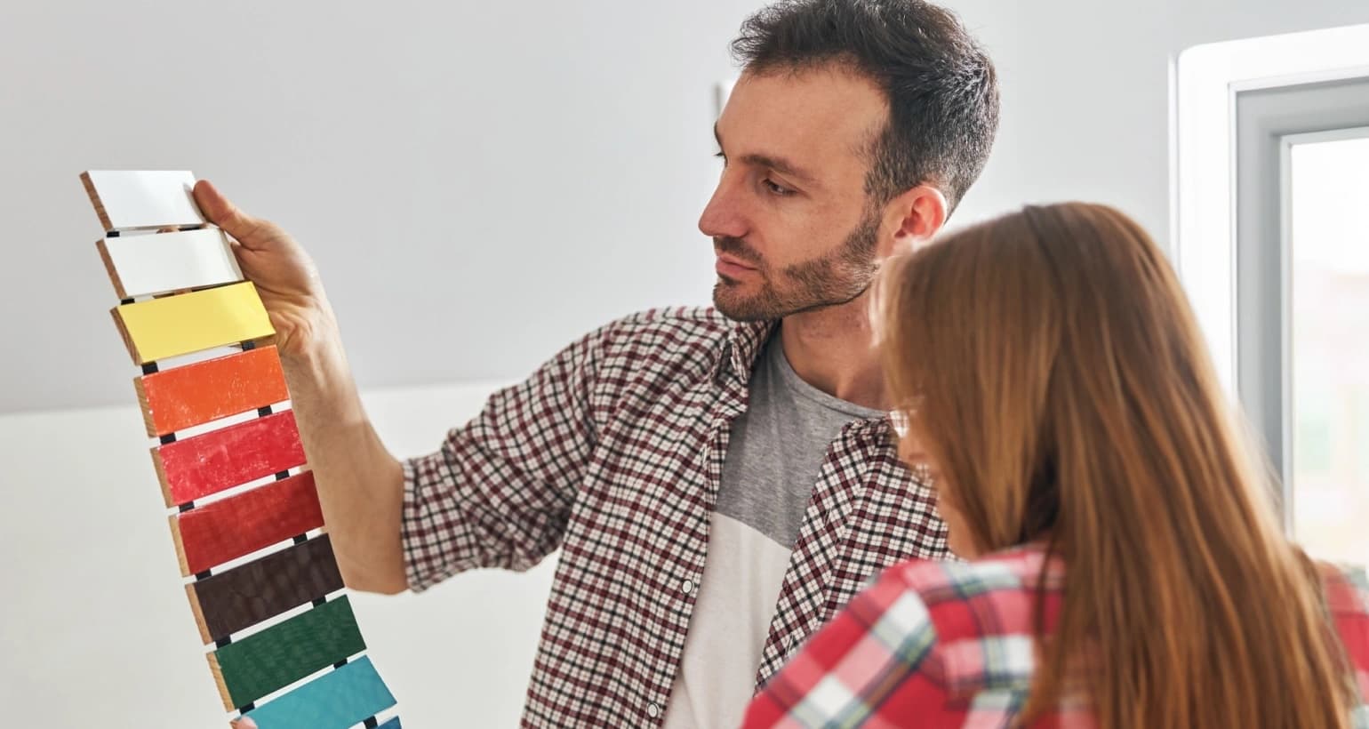 Curated paint swatches arranged on a Toronto kitchen counter
